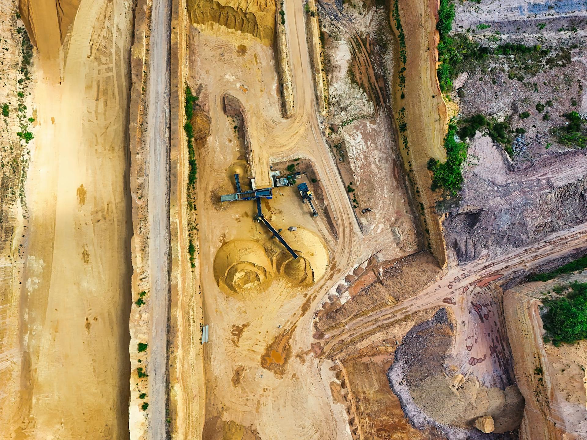 Aerial view of a large-scale mining operation showing the scale of extractive industry in Africa